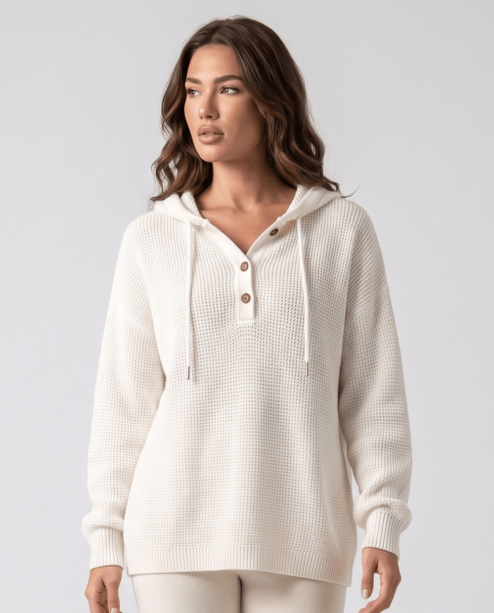 White waffle knit hoodie with buttoned neckline and drawstrings, front view