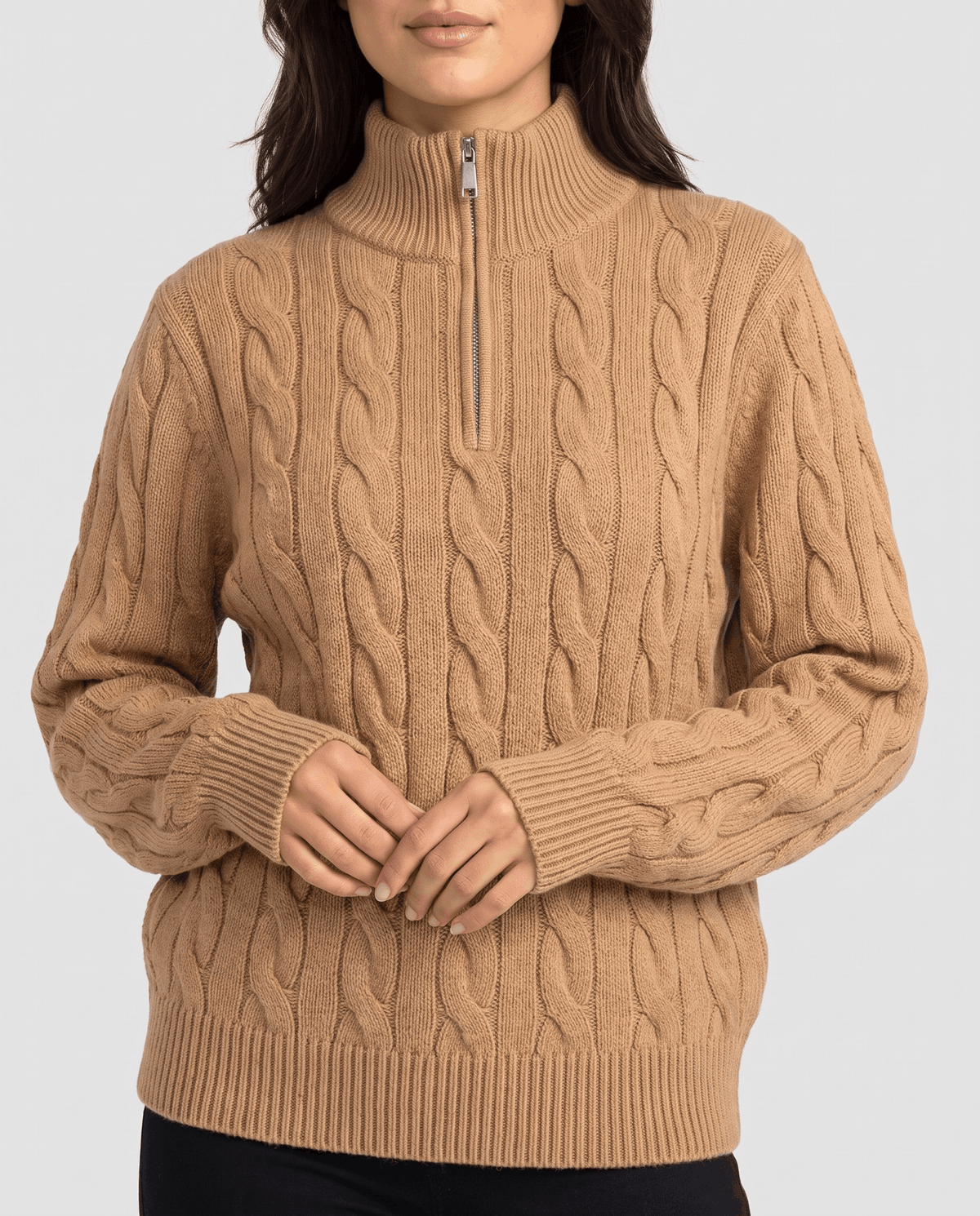 Close-up of camel sweater half zip, stand collar and cable braids