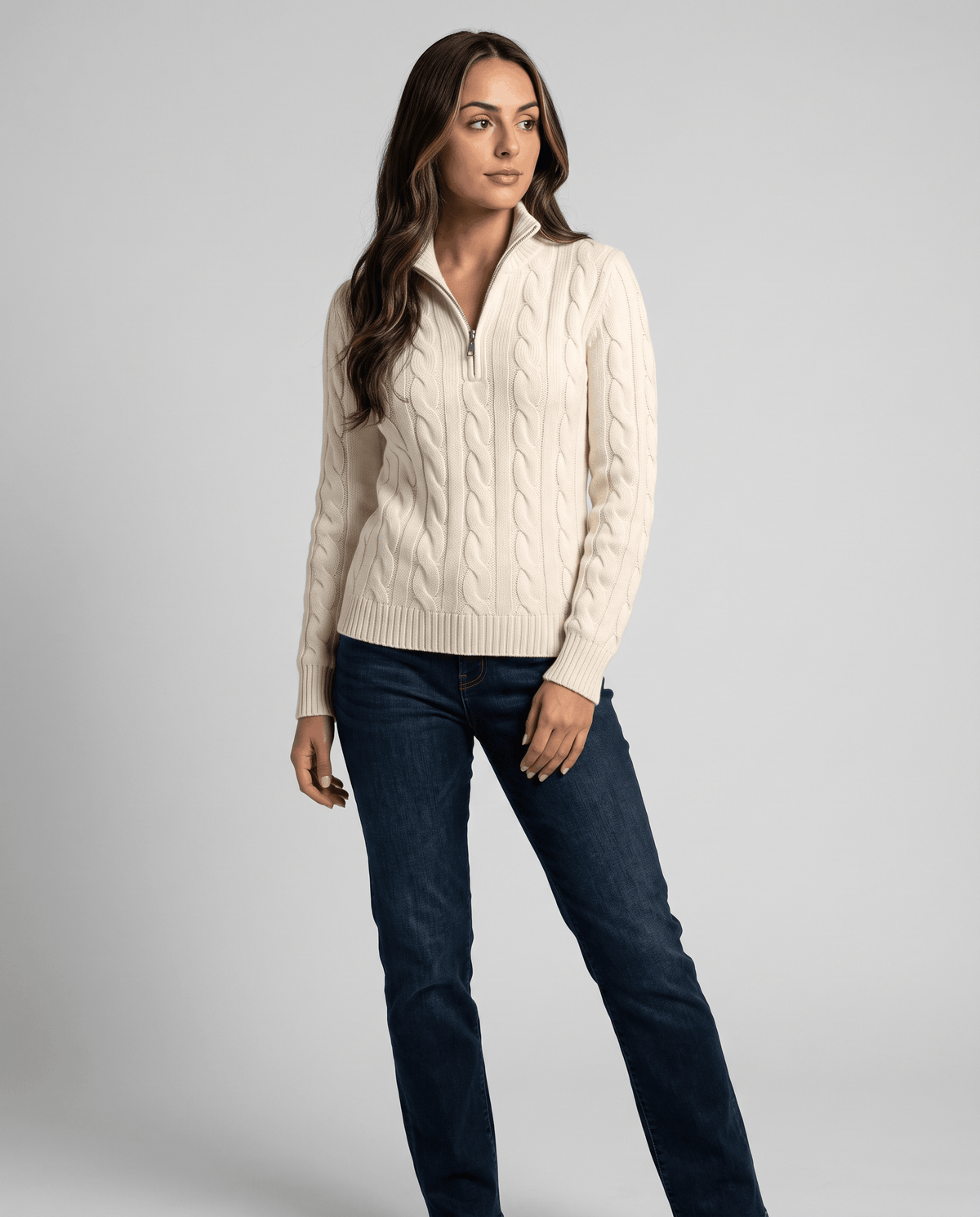 Full-length view of cream sweater with dark jeans