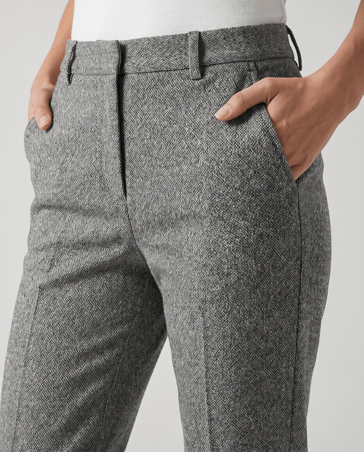 Front close-up of gray trousers with belt loops and slant pockets