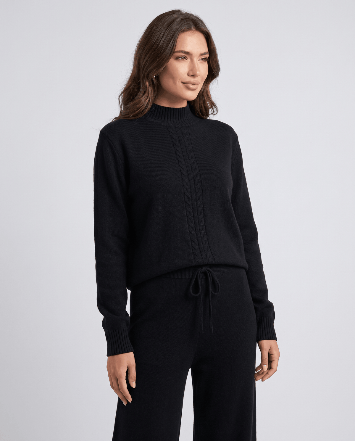 Black wool mock-neck cable knit pullover, front view close-up