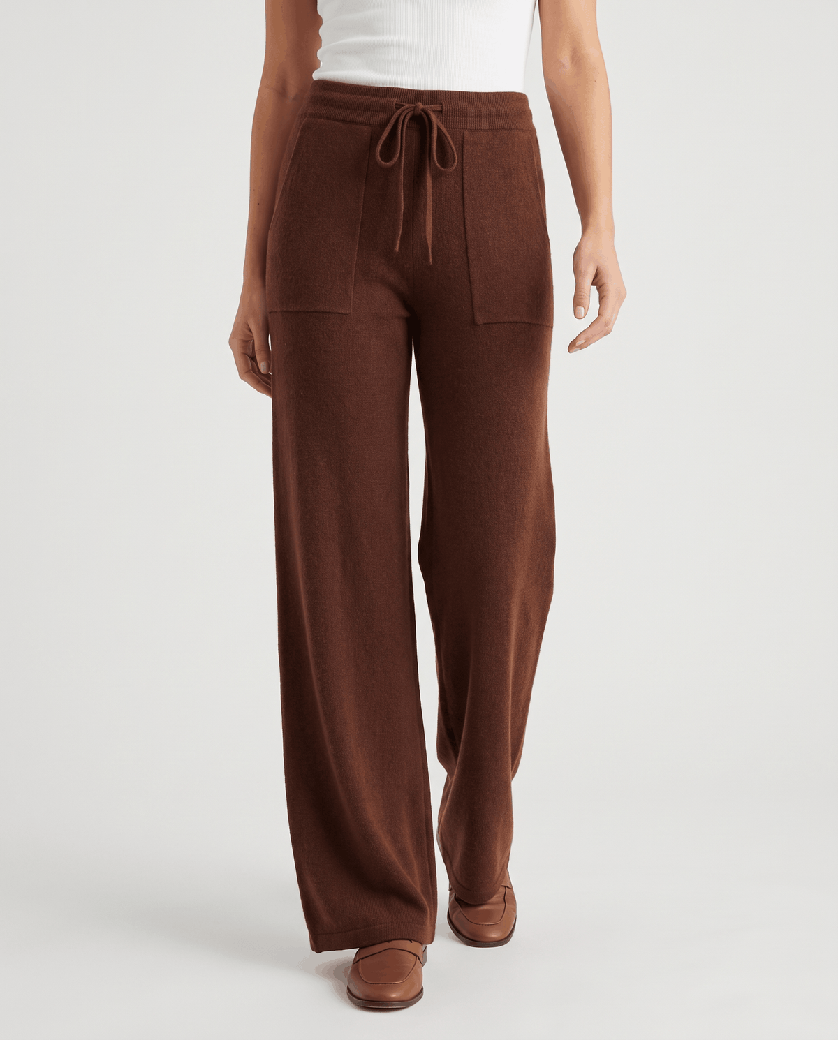 Wool wide-leg pants in brown, front view with drawstring tie and patch pockets