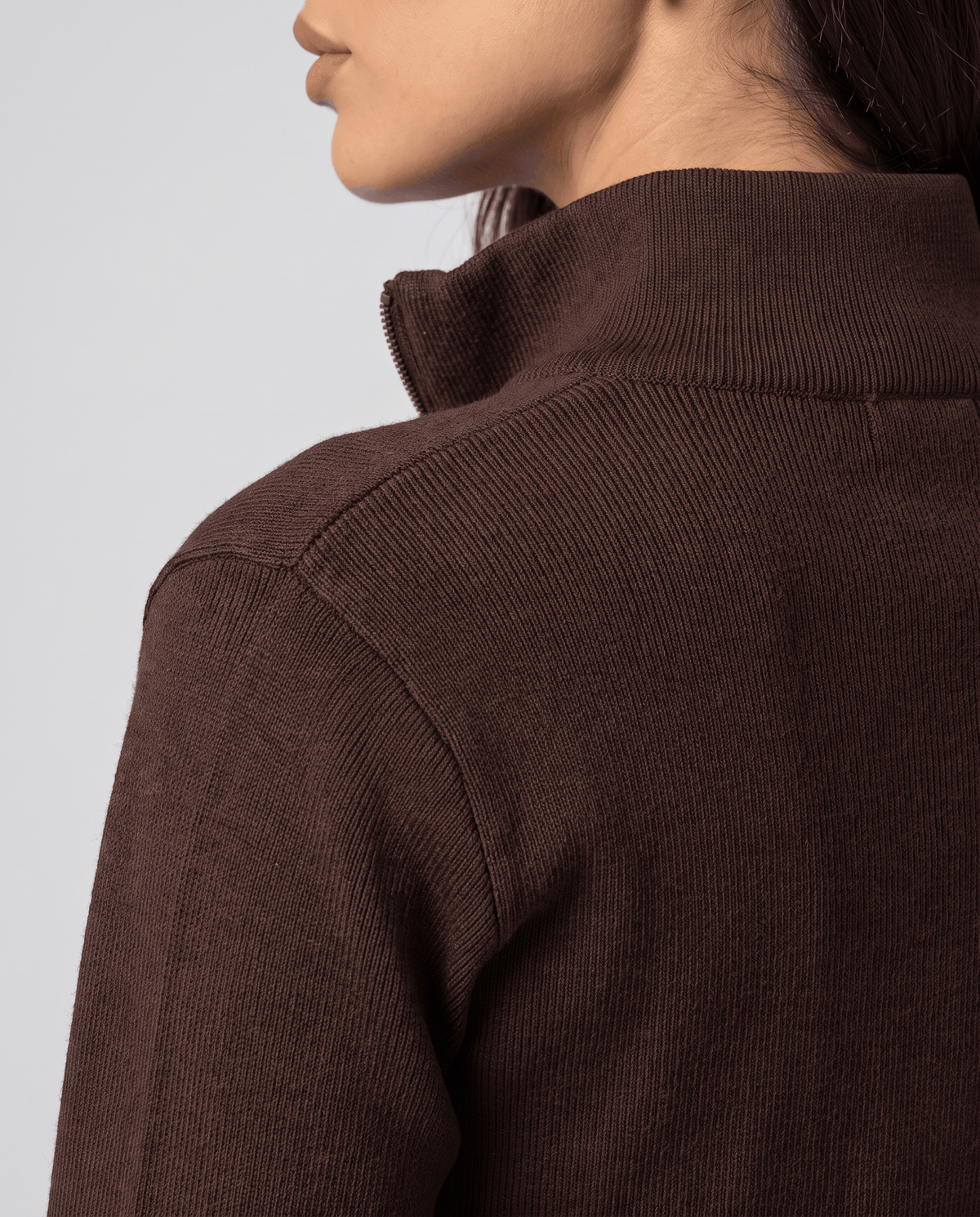 Close-up of the collar and shoulder on the brown knit cardigan